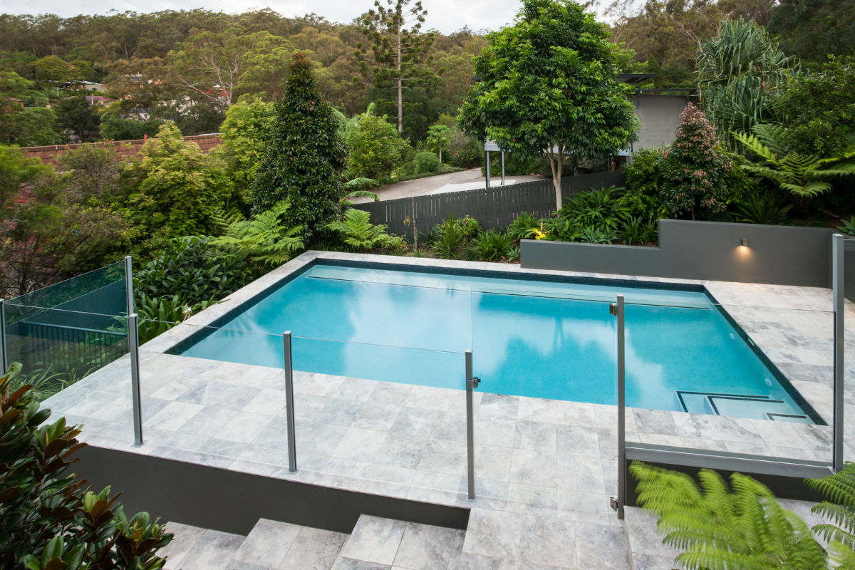 Glass pool safety fence around a suburban Victorian swimming pool